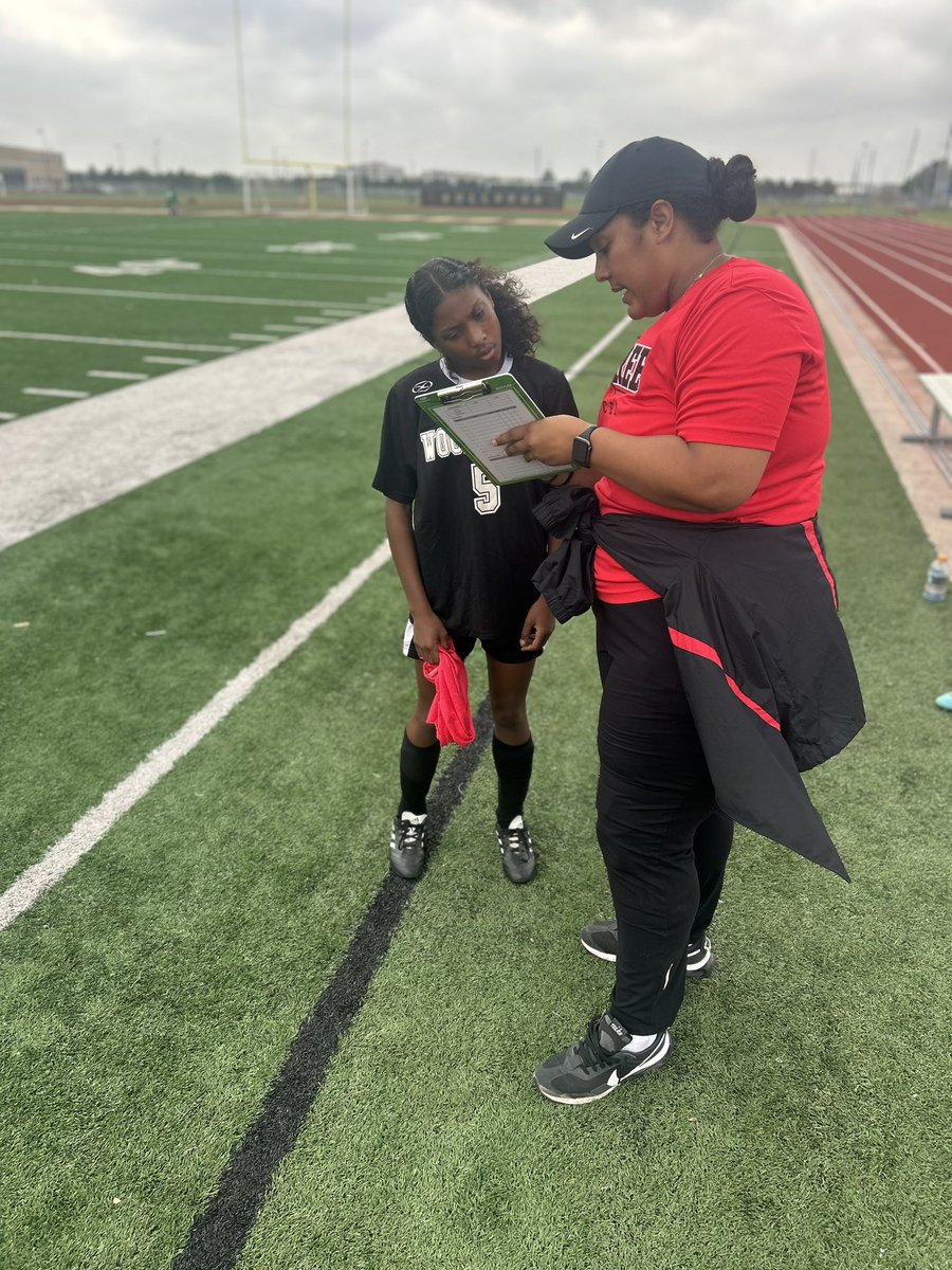 Coach Chase diving into the game as she talks it over with athlete Nylii Sigue!!