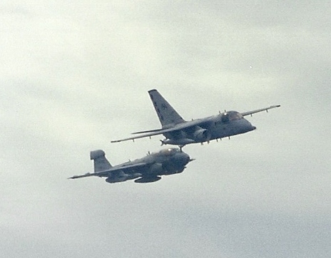 S-3 Viking Saturday, as the 'Diamond Cutters' of VS-30 do a flyover of CVN-65 with an EA-6B Prowler in tight formation.  Friends and Family Day Cruise, 1994.  #lockheed #grumman #ea6bprowler #s3viking #usnavy #navalaviation #flynavy #avgeeks #aviationphotography #aviation