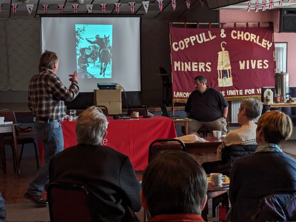 John Harris, with one of his most famous photographs of #Orgreave at the #Minersstrike40 meeting in Coppull.