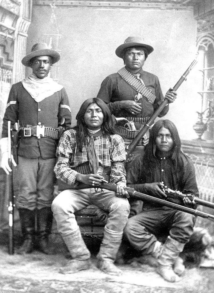 A Tenth US Cavalry trooper with Apache scouts. ca. 1885. Source - Sharlot Hall Museum