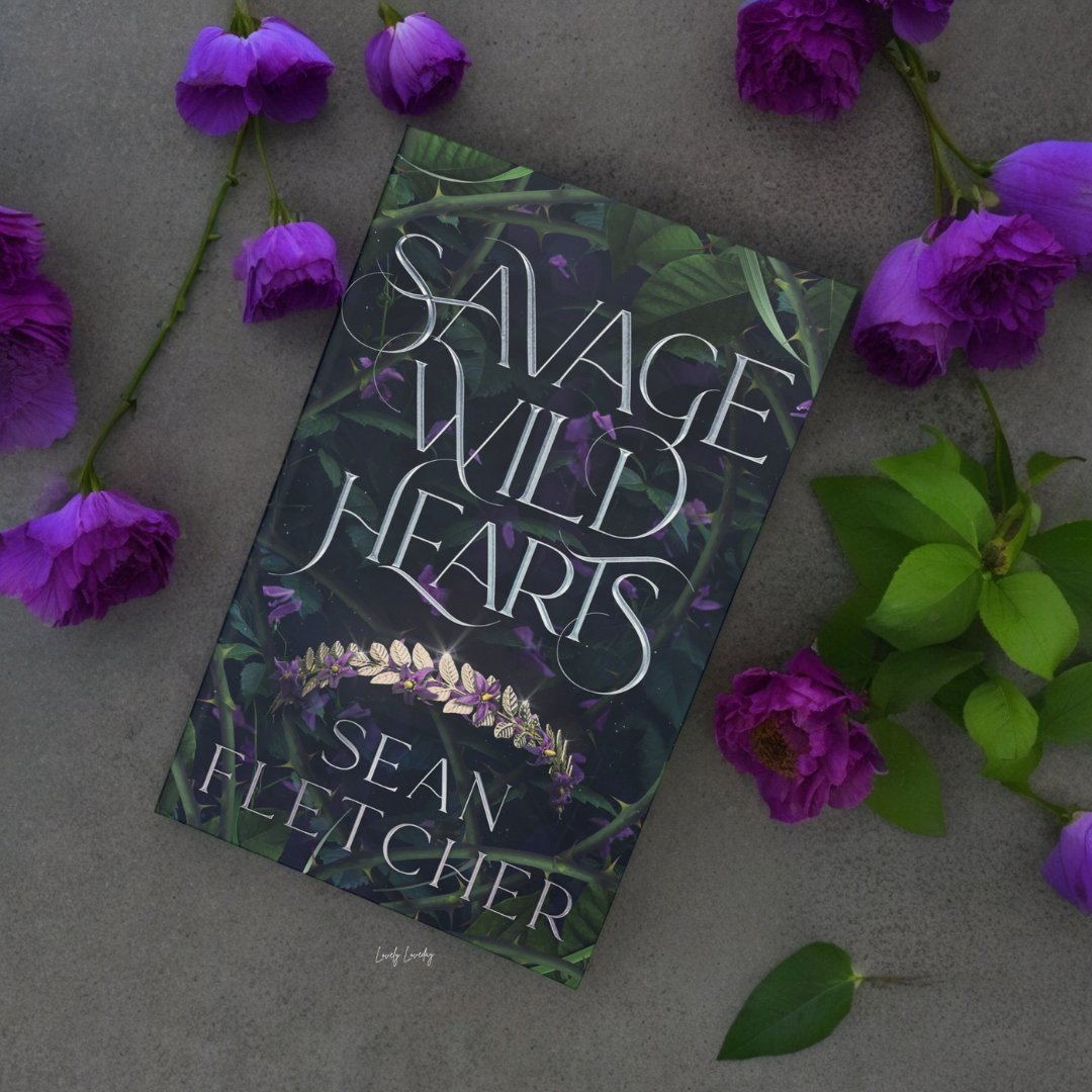 A lush YA fantasy novel filled with adventure, heartbreak, and an epic enemies-to-lovers romance. Thank you to the author for the #gifted copy! Savage Wild Hearts by Sean Fletcher goto.target.com/R5VAxb @seannfletcher