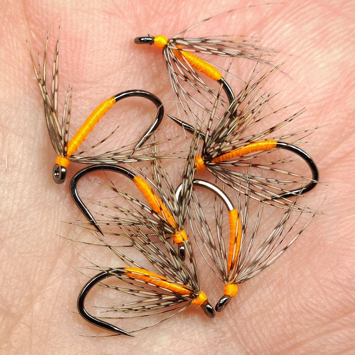 'Partridge and fluorescent orange on size 14 @umpquafeathermerchants XC290BL-BN hooks with @textreme_fly_fishing 75D midge thread and partridge from a skin that a friend in Wyoming recently sent to me.' // tie and image by Peter Steen @fly_fishing_pete