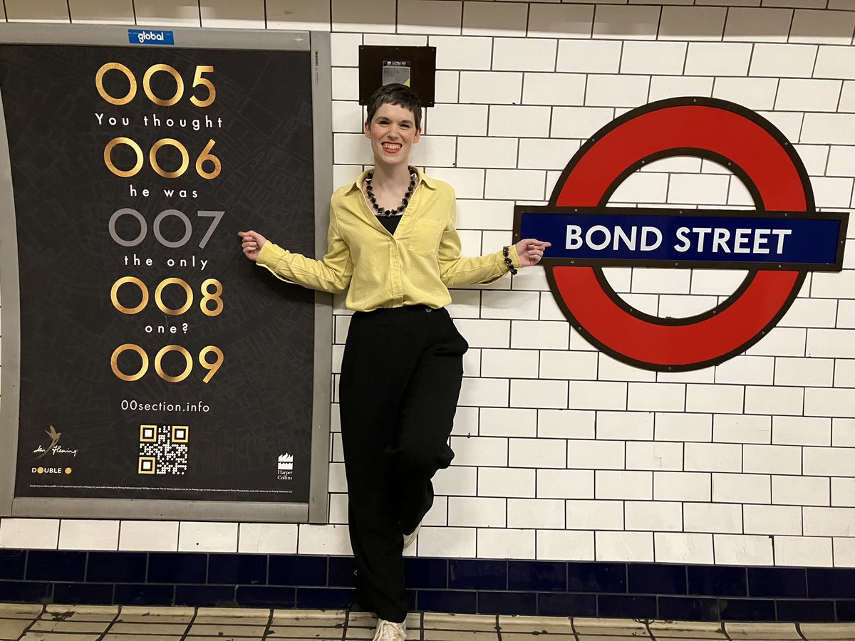 How Cool Is This? Kim by the poster created to launch A Spy Like Me in actual Bond Street Tube Station! Happy Launch week. #aspylikeme @kimtsherwood @ianflemings007 @harperfiction