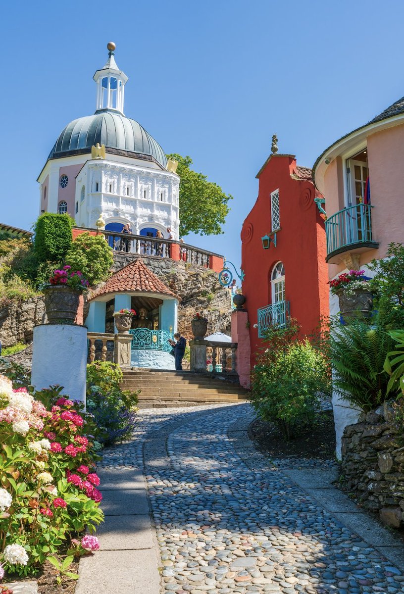 🏰 Explore Portmeirion 🌺

 Wander through colorful buildings, meandering pathways, and lush gardens designed by Sir Clough Williams-Ellis. Immerse yourself in the whimsical charm of this unique destination, Portmeirion is a true gem waiting to be explored.