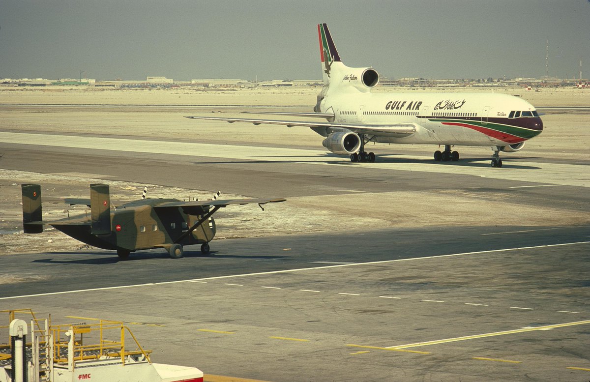 1983, Dubai Airport: A Gulf Air Tristar heads to the terminal, as a Sultan's Armed Forces Skyvan waits to taxi to the runway for a departure back to Muscat.