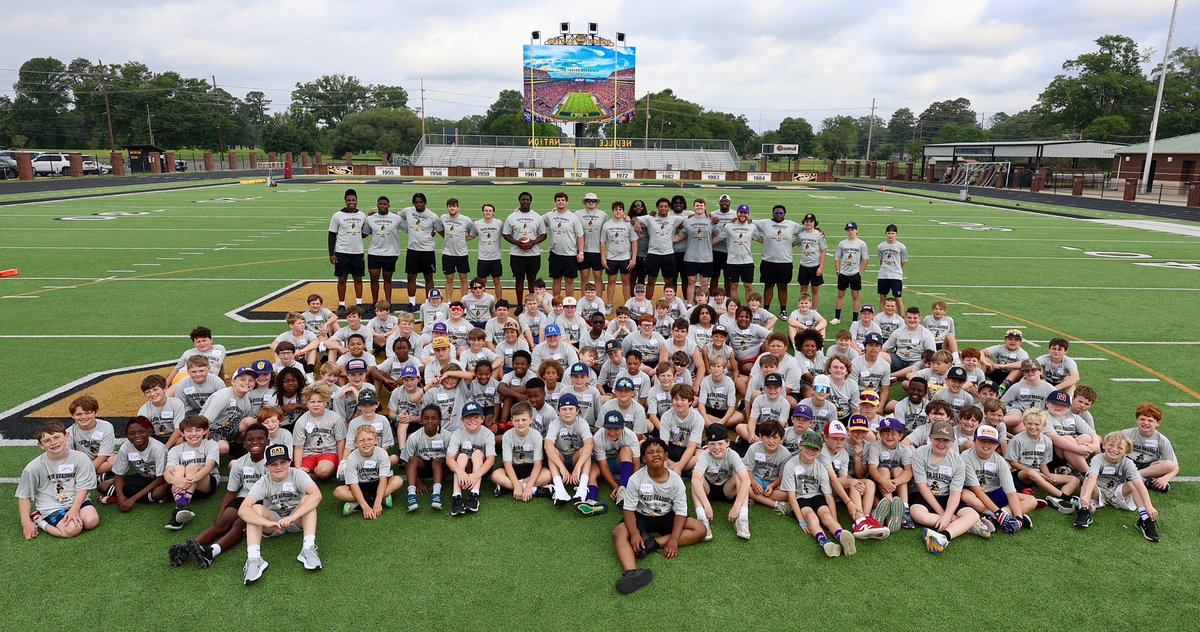 The inaugural Tarver Braddock Memorial Camp. Will Campbell, surrounded by several LSU Tigers, leads the youth skills camp.