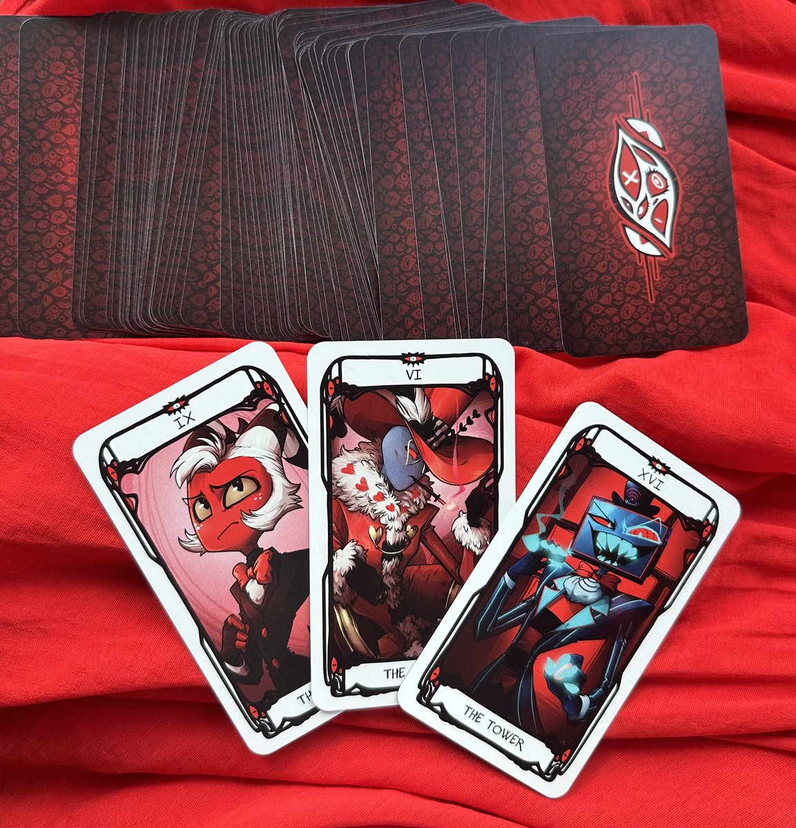 The Hazbin Hotel & Helluva Boss tarot deck by @quiem_rhole is SO gorgeous, pictures do NOT do it justice! My readings have never looked so hellish 🔥❤️
