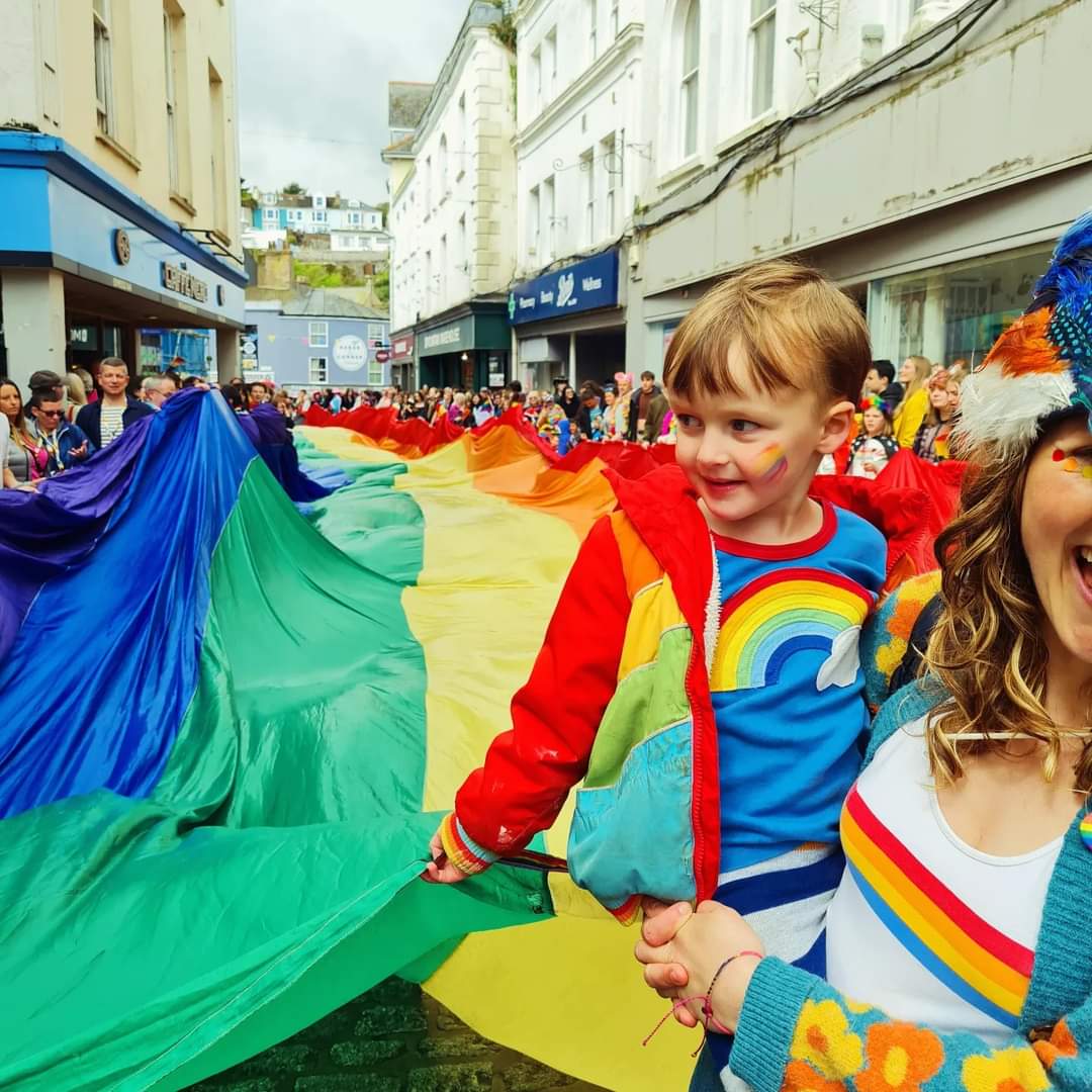 A fabulous moment as the smallest one led the front of the worlds largest pride flag. #friendsinprideplaces #Cornwallpride #Falmouthpride #falmouthpride2024 #cornwallpride2024 #prideflag #worldslargestprideflag