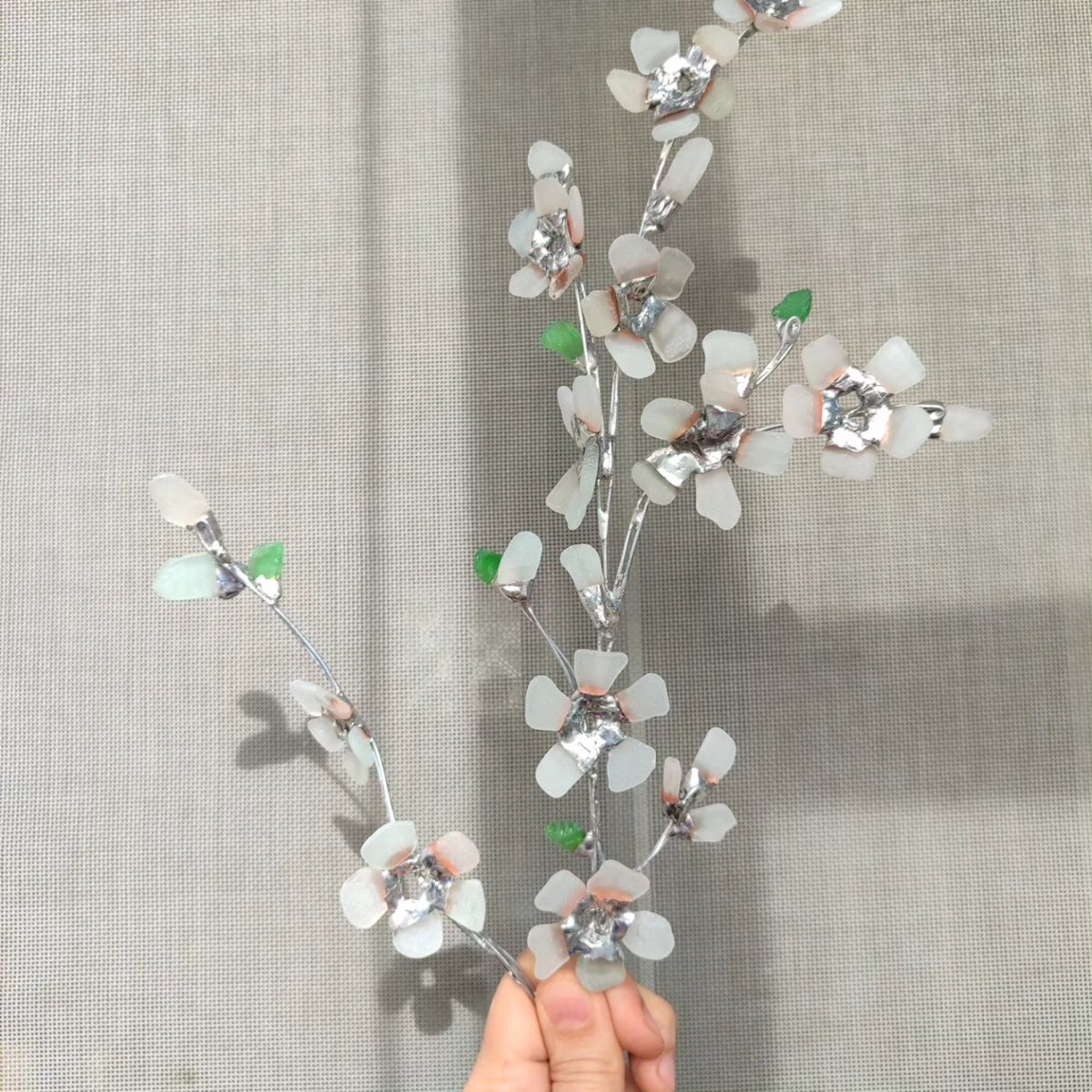 Sea glass cherry blossom 🌸 🌿 #SeaStainedGlass #stainedglass #glassart #stainedglassart #seaglassart #handmade #art #seaglass #trashtotreasure #recycledart #trashart #recycled #upcycle #botanicalart #blossom #seaglassflowers #seaglasslove #seaglassaddict