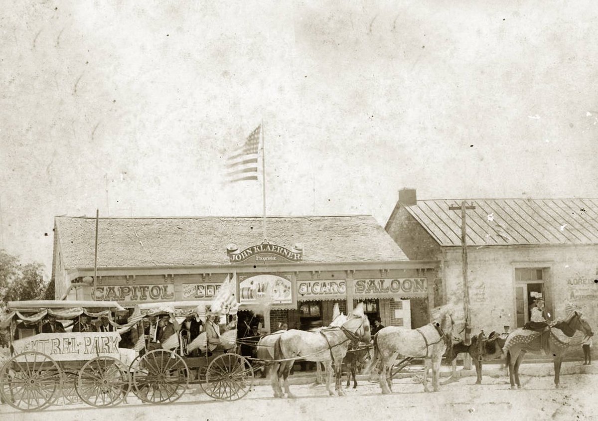 A parade passes John Klaerner's saloon in Fredericksburg, Texas, circa 1890.

Courtesy the Portal to Texas History.
