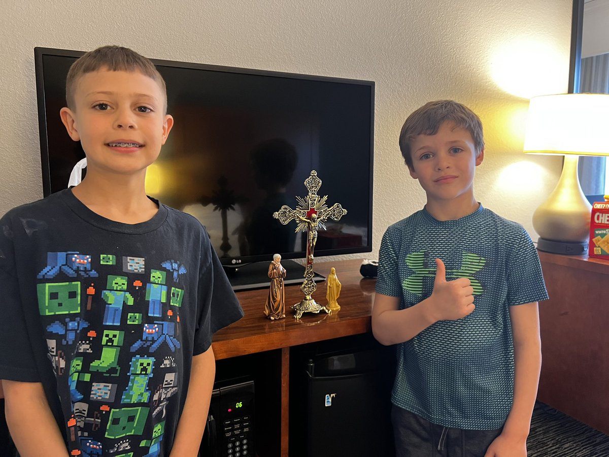 At a hotel for a conference, and the boys unpacked their suitcase right in front of the TV. I swear, I didn’t know… Instead of toys, they’d packed weaponry. St. Padre Pio, crucifix, Blessed Mother #proudfather #PadrePio @SaveYourSons @Incensum_CCC
