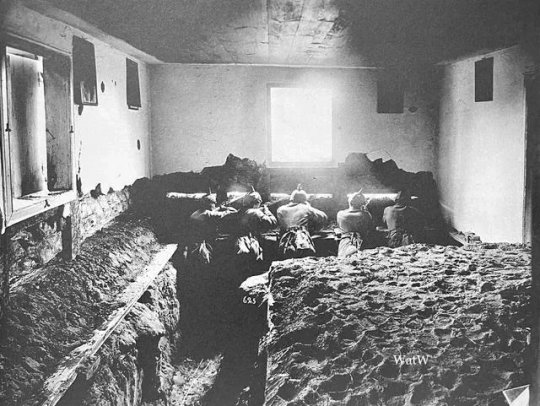 Imperial German soldiers use a house, adapted to encompass their trench to keep watch for any sign of enemy troop movements (August, 1914)