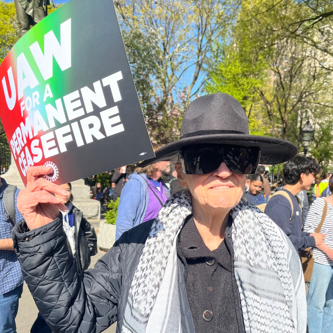 UAW's tweet image. Hundreds of students and faculty from NYU, Columbia, Barnard, and the New School gathered in Washington Square Park Friday to make it clear that @UAWRegion9A will stand up for members, for academic freedom, for freedom of speech and protest. #StandUpUAW #solidarity
