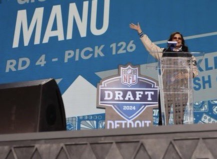 Pictured: Former President Gretchen Whitmer, ageless, announcing my son Manu’s selection by the Lions in the 2044 NFL Draft.