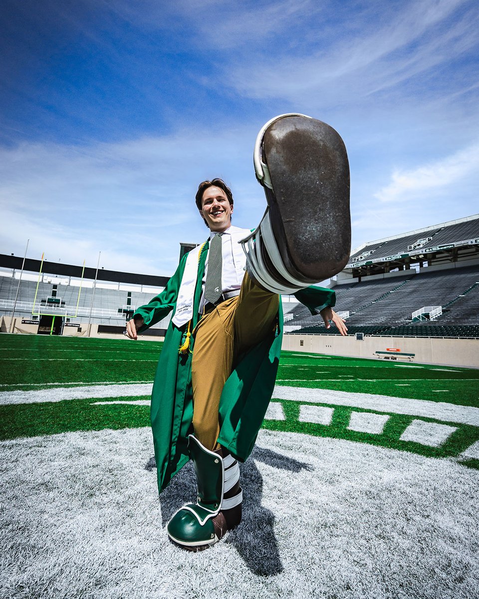 michiganstateu's tweet photo. When you're Sparty, you get to wear the boots at graduation to reveal your secret identity.  

Congrats, Connor! Thanks for representing the Green and White so well. #SpartanGrad24 https://t.co/eD47RoCFIT