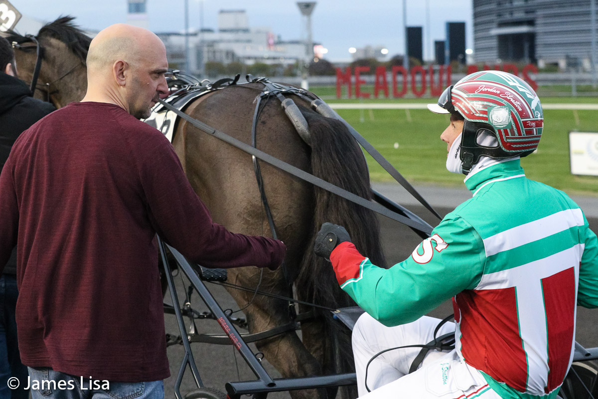 Mike @Russo_Stable congratulates Jordan @stratton_racing after winning the New Jersey Breeders Maturity with Voukefalas @themeadowlands @JessicaOtten1 @DaveLittleBigM #harnessracing #PlayBigM