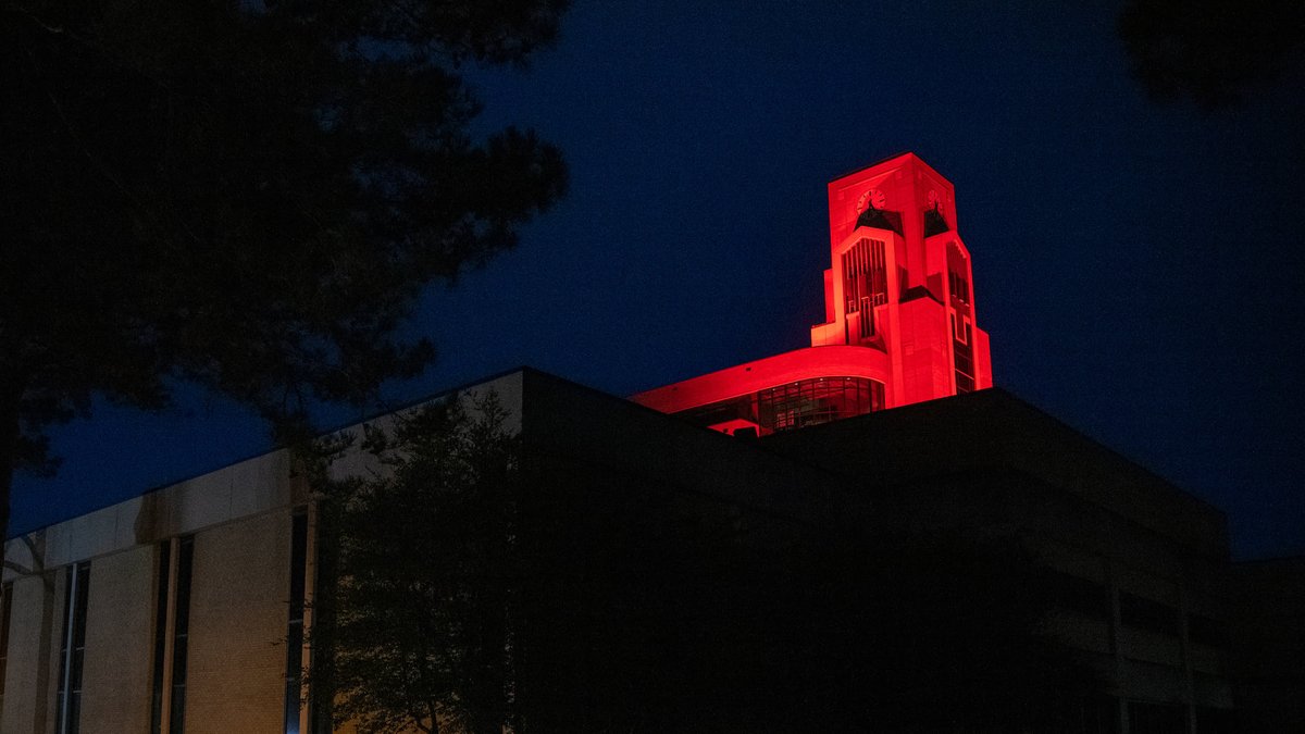 The clock tower of the Dean B. Ellis Library will be lighted scarlet this evening to celebrate the second Sun Belt Conference championship in program history for the Arkansas State men's golf team. #WolvesUp