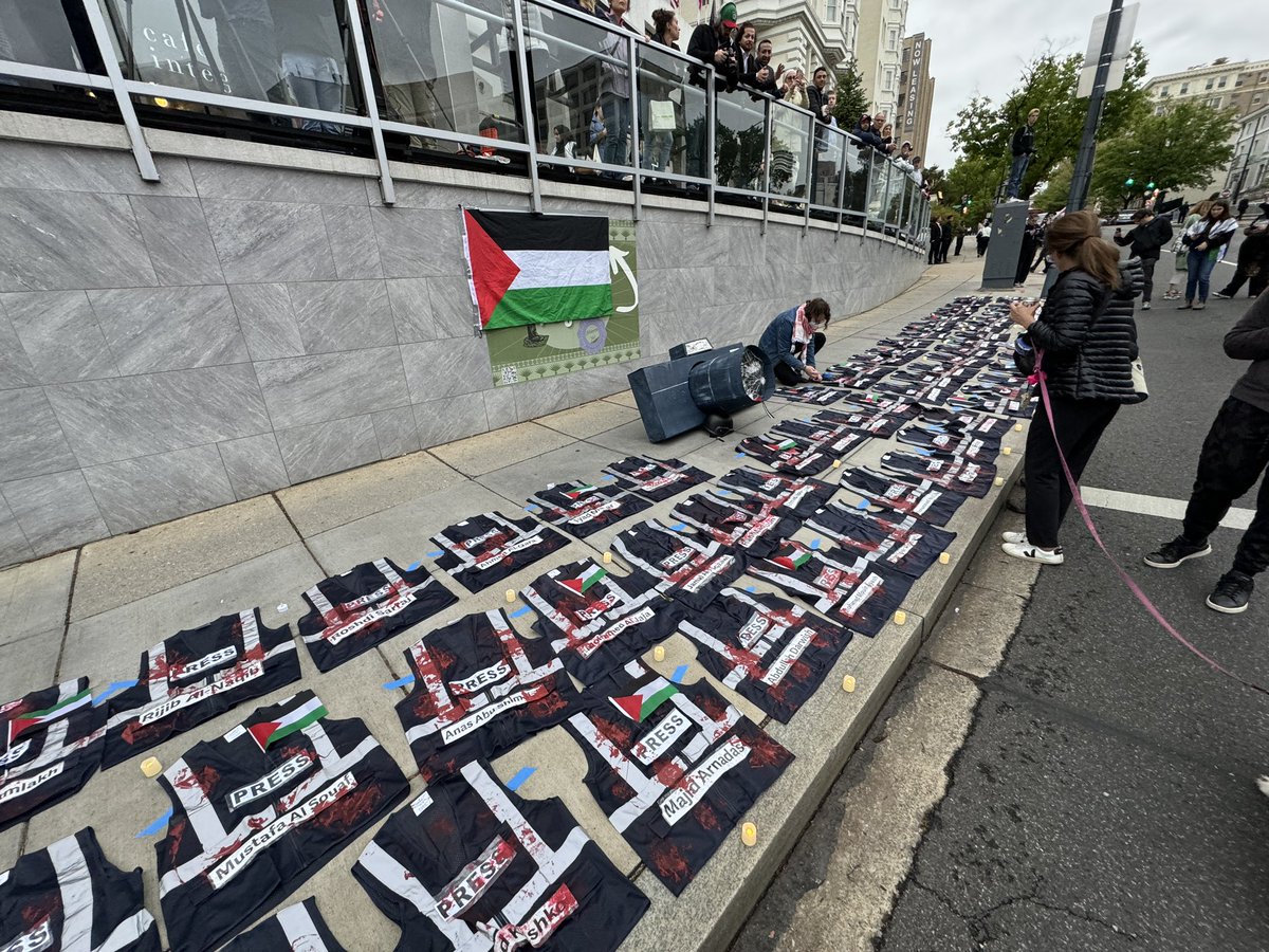 Names of Palestinian journalist killed by Israel in Gaza and the West Bank. On display across the street from the White House correspondents dinner while attendees are harassed as they enter, asked why are they dining with the person who arms Israel? #WHCD