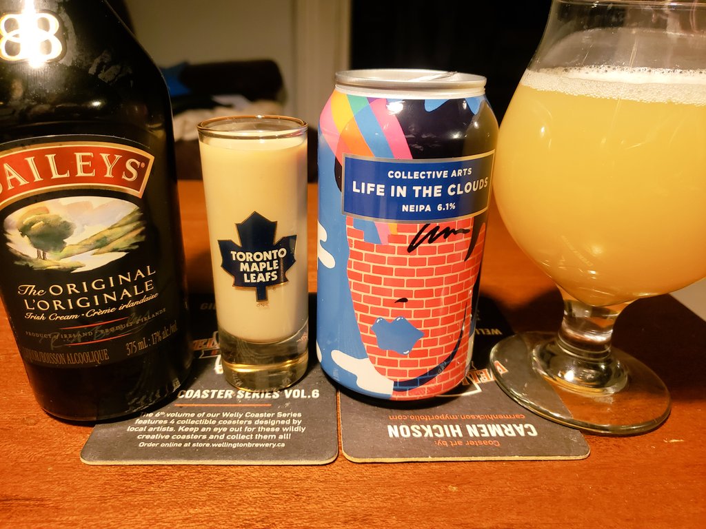 LEAFS VS BRUINS GAME FOUR 1ST PERIOD BEER! Found a Leafs shot-glass today and decided to use it tonight to gauge its Luck Factor. Baileys in that and a @CollectiveBrew Life In The Clouds New England IPA in the glass. Melon, 6.1%. We need to tie this series up tonight. GO LEAFS!