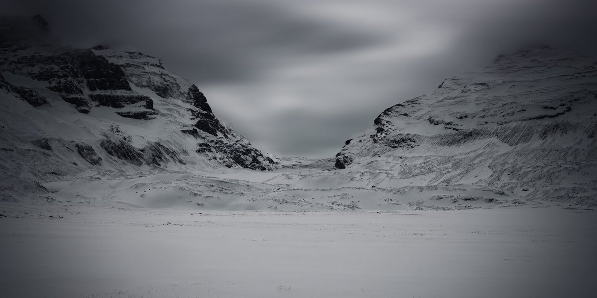 Embark on an exhilarating adventure through winter's icy embrace with my latest addition to the 'Serene Seasons' collection: a thrilling glimpse of the Athabasca Glacier! Discover the rugged beauty and untamed spirit of nature in its harshest environment.