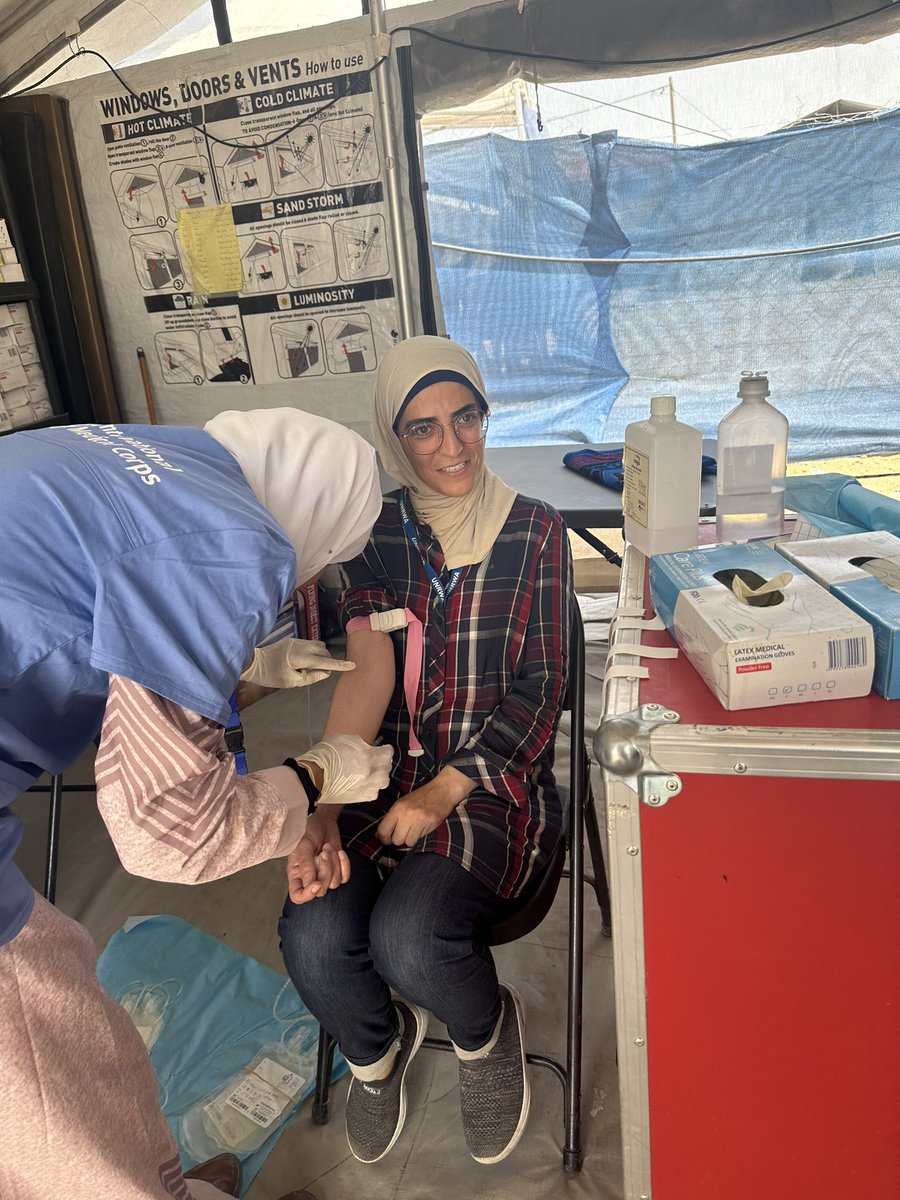 My colleague and friend Mona this week, donating blood at a field hospital in #Rafah We were visiting our colleague Abdallah, who was severely injured by bombardments - when Mona learned they had the same blood type she donated immediately. People doing whatever they can.