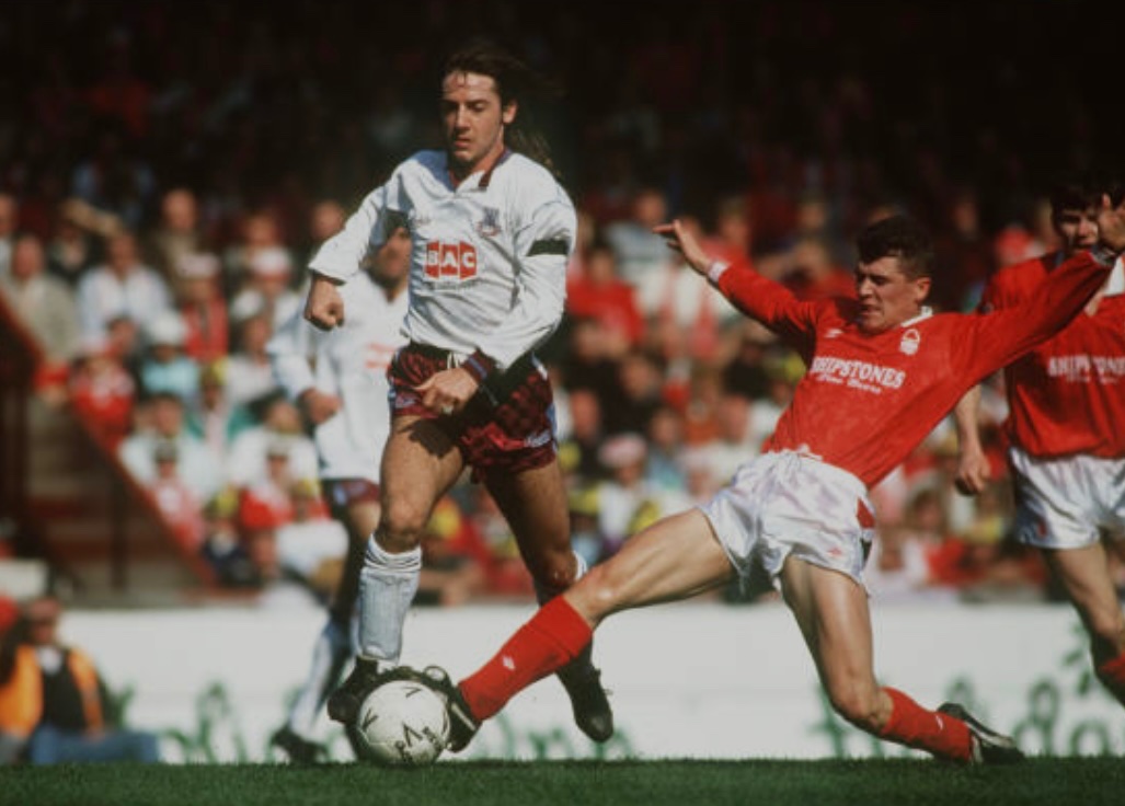 14/4/91. Bish attempts to escape the clutches of Forest midfielder Roy Keane during the Villa Park FACSF defeat.