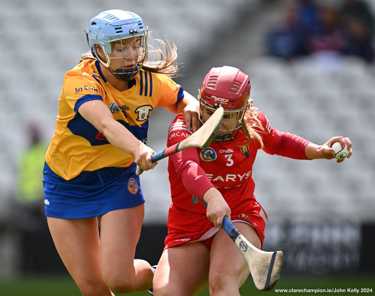 Caoimhe Cahill of Clare in action against Libby Coppinger of Cork during their Munster semi-final against Cork in Supervalu Páirc Uí Chaoimh. Photograph by John Kelly. The score at half time is @ClareCamogie 1-03 , @CorkCamogie 1-10 @MunsterCamogie #OurGameOurPassion