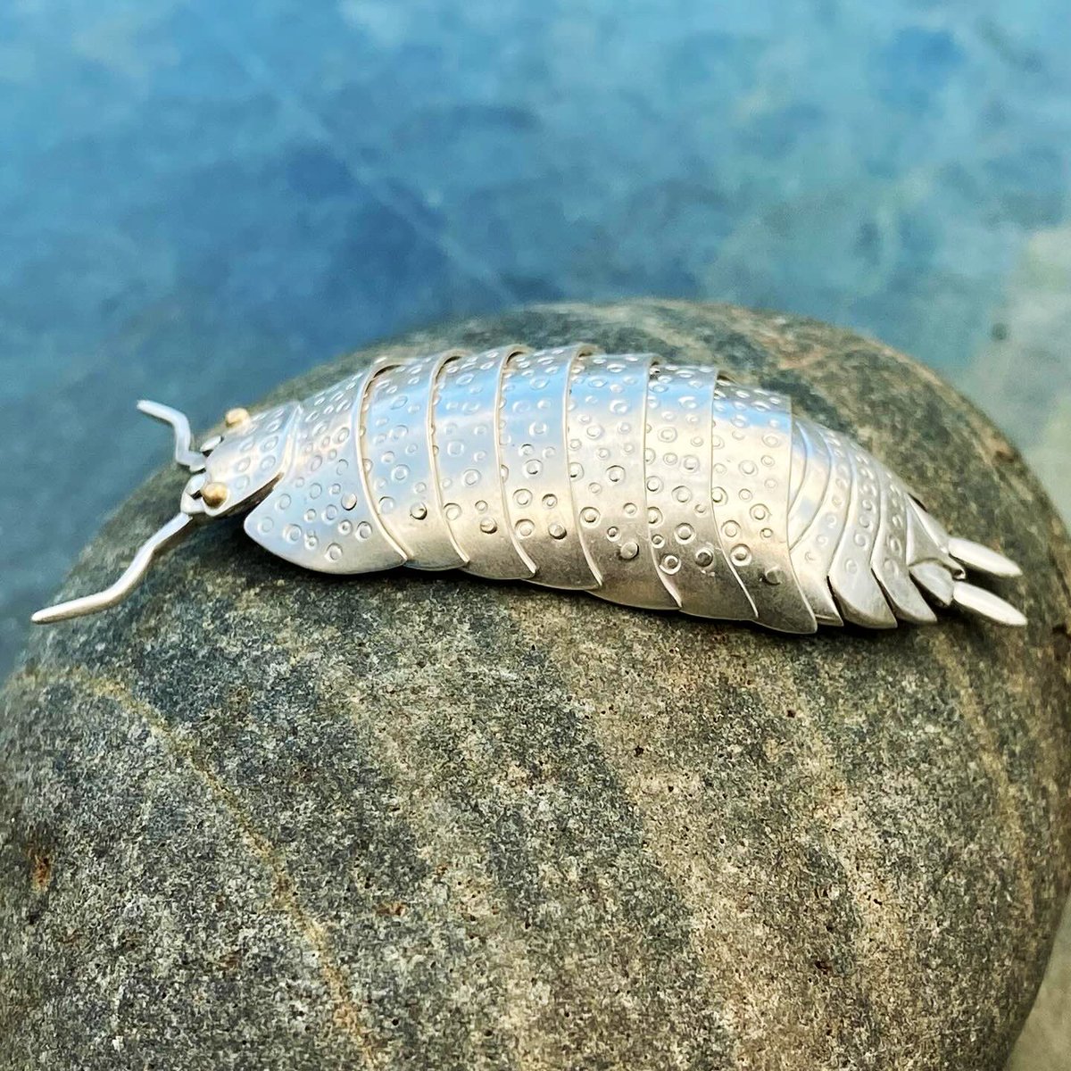 A piece I just finished today - handmade articulated Sterling silver isopod with 18ct gold eyes & moveable antennae. 52mm long, not including the antennae. Wearable as a pendant