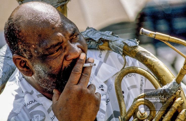 A New Orleans musician takes a break. Louisiana, USA. Gary Moore photo. Real World Photographs. #louisana #usa #music #musician #smoke #neworleans #malmo #canada #sweden #photojournalism #world #documentary #photography #garymoorephotography #denmark #realworldphotographs #nikon