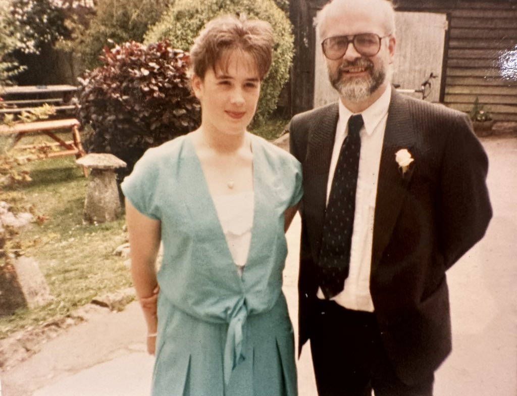 rhipratchett's tweet image. Even when attending a wedding (circa 1990) Pratchetts will always look slightly scruffy. Not my colour, not his suit, but we’re both looking at the camera. Albeit in a slightly bemused way. He would’ve been 76 today. GNU Dad. Happy Birthday. #Speakhisname #TerryPratchettDay ❤️