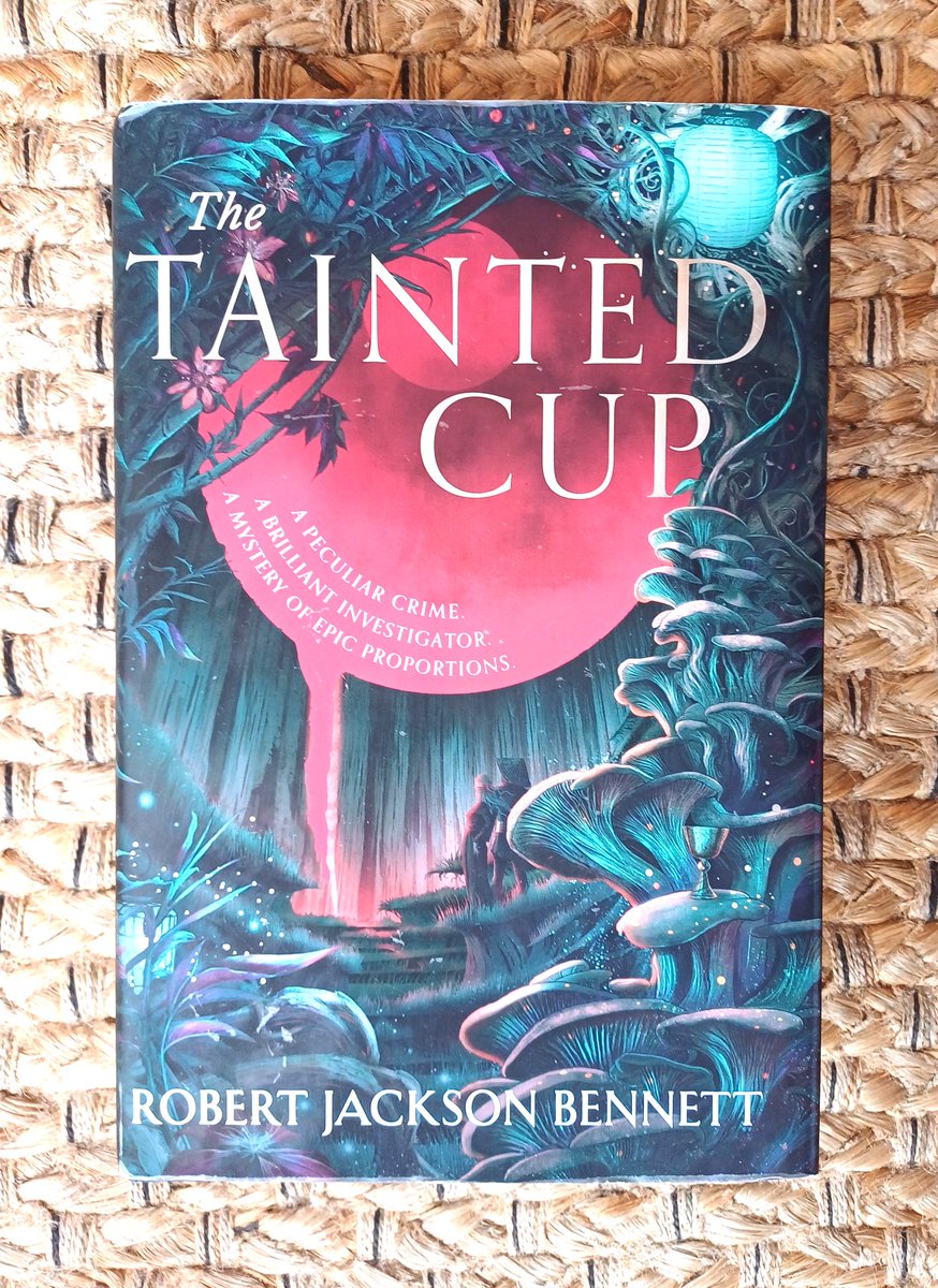 Latest read! The Tainted Cup by Robert Jackson Bennett #amreading Don't read much #fantasy these days but it's a #mystery and kind of a police procedural and I was sold on it by Nick's @NickRevws glowing #BookReview - see below! outofthisworldrev.blogspot.com/2024/02/book-r…