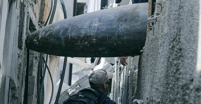 Unexploded 2,000-pound Israeli bunker buster bomb in a densely-populated neighbourhood in Gaza; the 1st thing people wake up to & sleep next to This bomb is a US-made GBU by Boeing The UN estimates it'll take 14 YEARS to clear the 10,000s of tons of unexploded ordnance in Gaza!