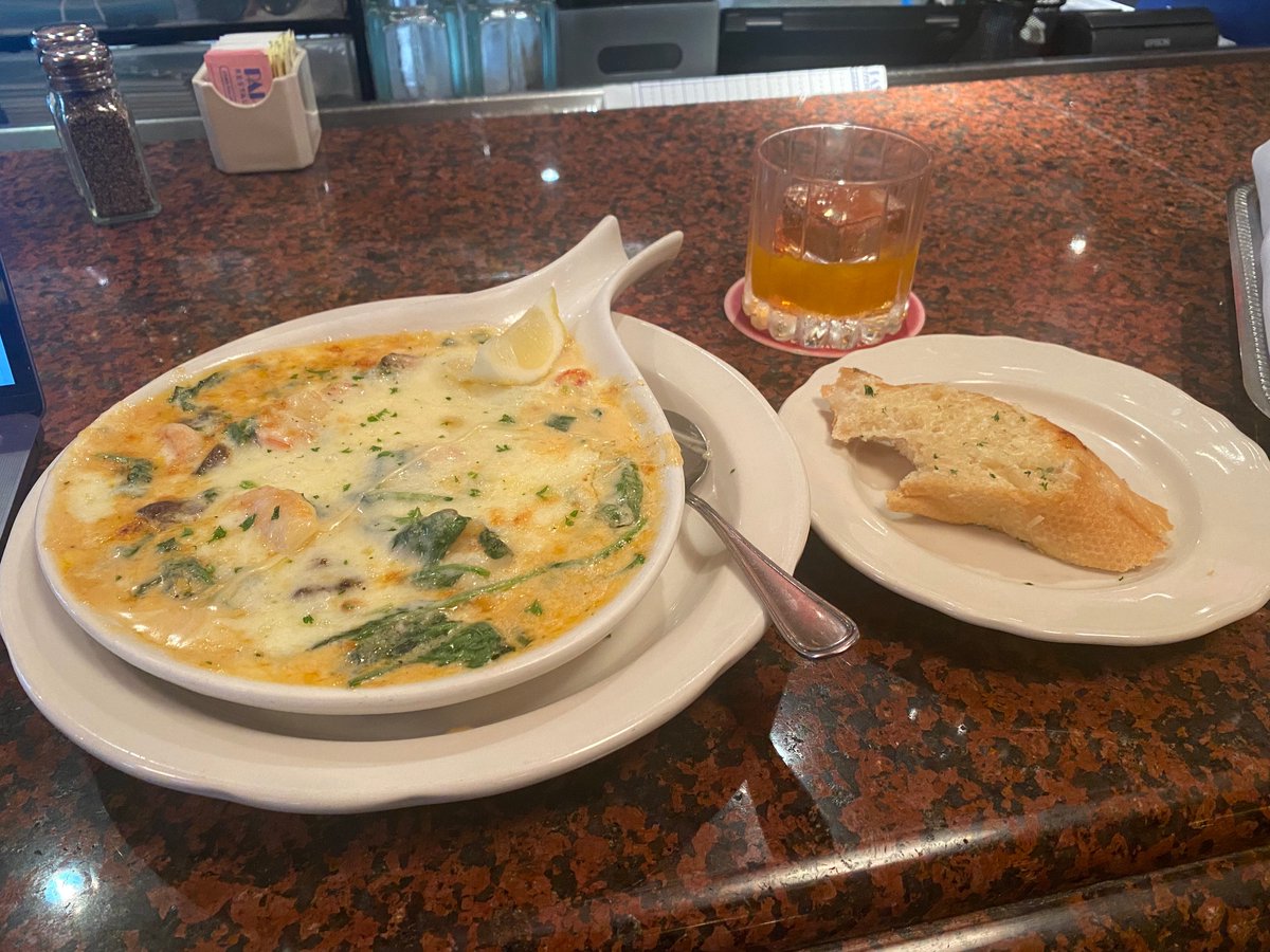 I don't often post food pictures, but I had a long enough layover in Houston yesterday to pop into Pappadeaux for a shrimp and crawfish fondeaux, served with garlic bread. And an Old Fashioned. It was all superb!