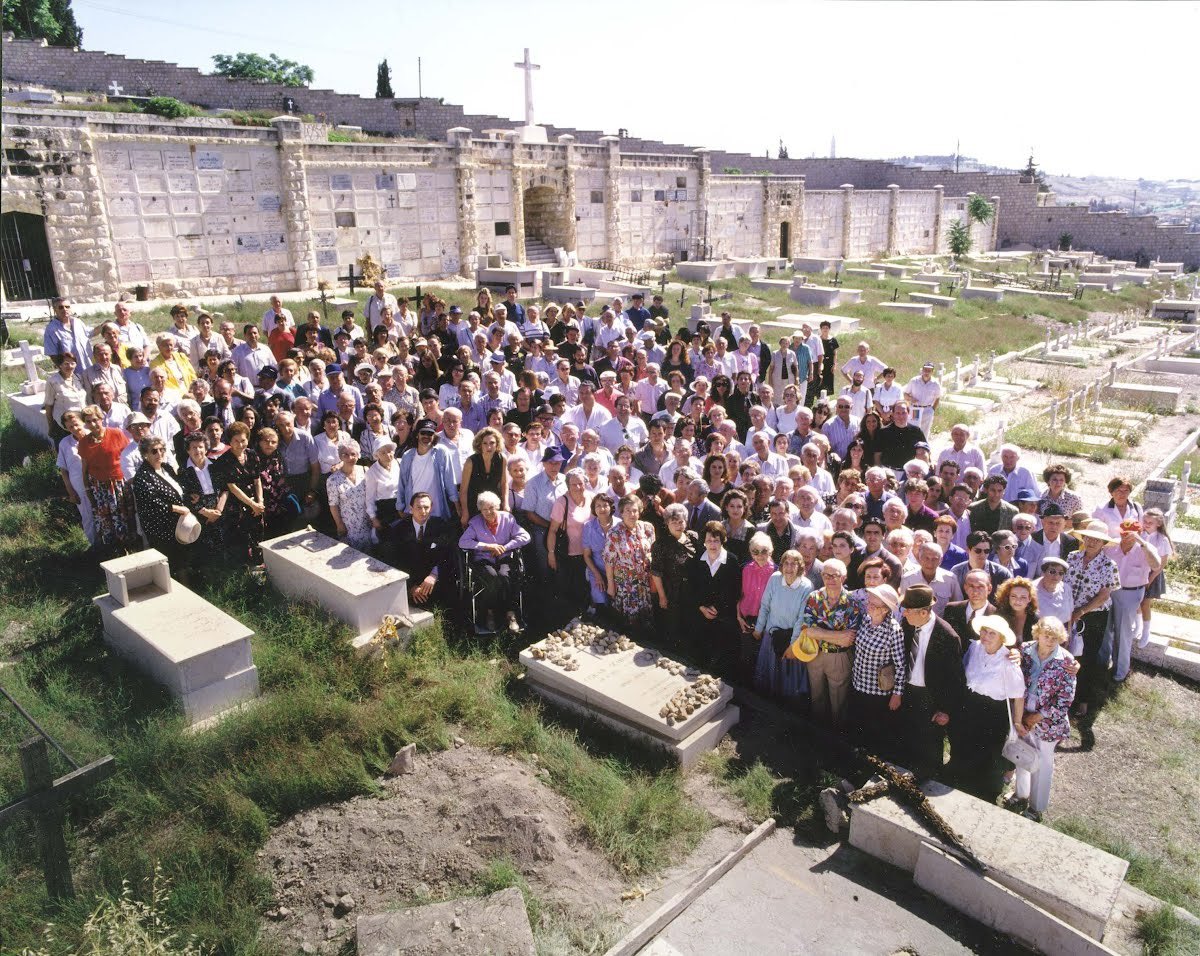 Oskar Schindler was born on April 28, 1908. Pictured here are Holocaust survivors saved by Schindler, alongside individuals from the 'Schindler’s List' movie, standing next to his grave in Jerusalem. Oskar Schindler was responsible for saving the lives of 1,200 Jews, and in