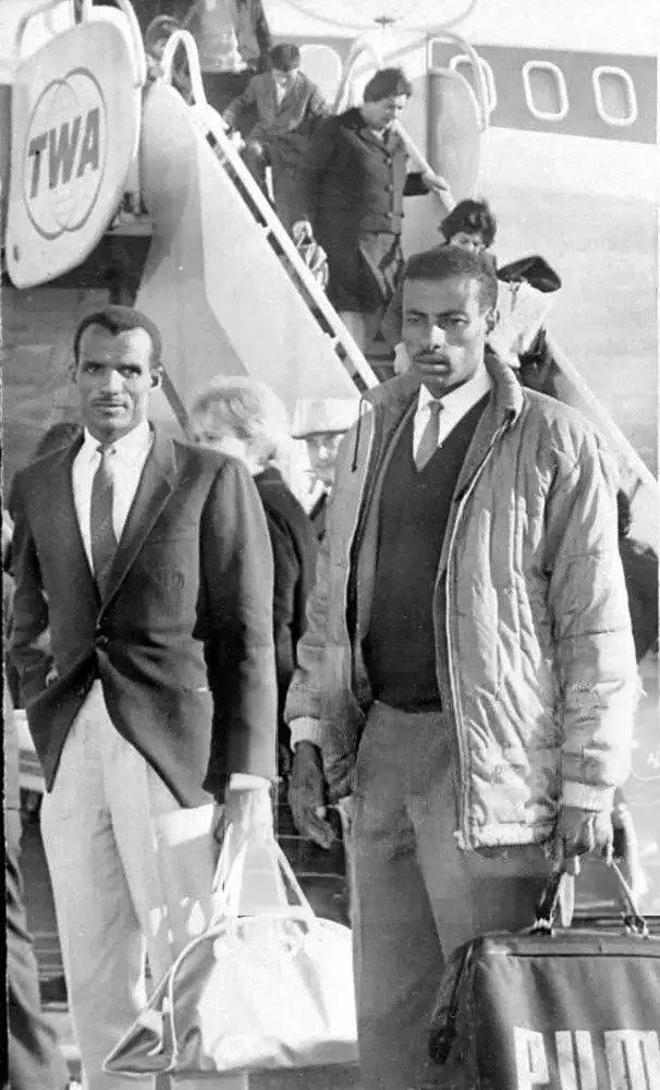 Abebe Bikila, the Ethiopian marathon runner is seen arriving at New York airport with Sgt. Mamo Wolde, his Olympic team mate. April 1965