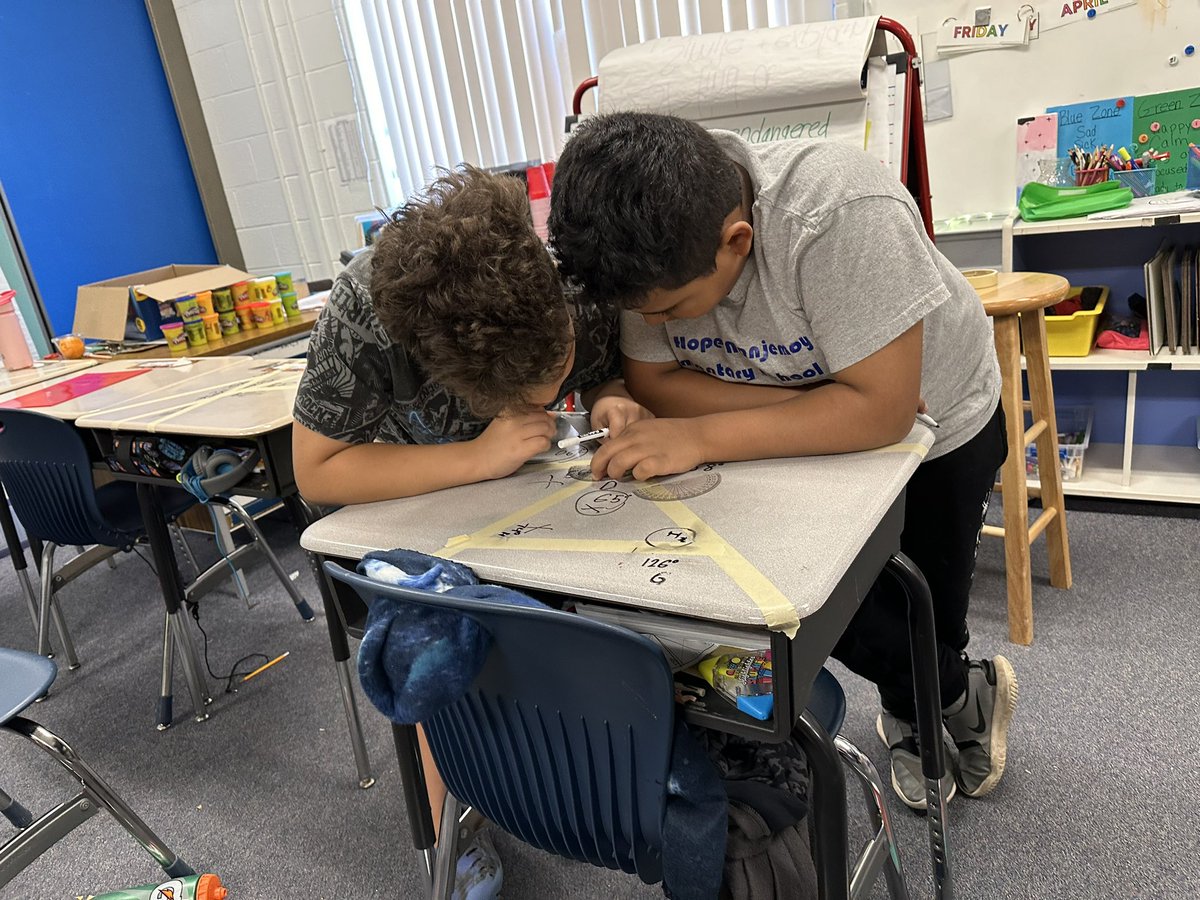 MrsJuracko's tweet photo. With many intersecting lines made on their desks, students labeled angles &amp; measured them to practice measuring to the nearest 1 degree. Then their buddy checked them &amp; provided feedback. Such a fun way to practice! 💙💛@MtHopeNanjemoy @MikeHoffmanCCPS https://t.co/jYlh4sOU4u