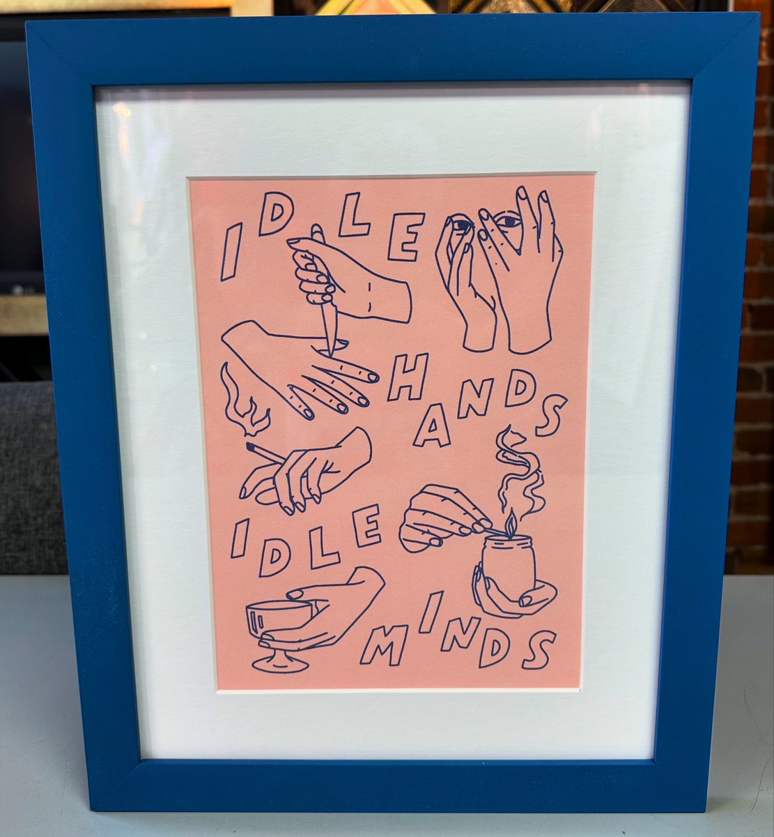 ‘Idle Hands’ by Is This Real Life? custom framed using acid-free matting, UV glass and frame by AMPF Moulding! #art #denver #colorado #pictureframing #customframing #5280customframing #idlehands #isthisreallifestudio @truvueglazing @Crescent_CP