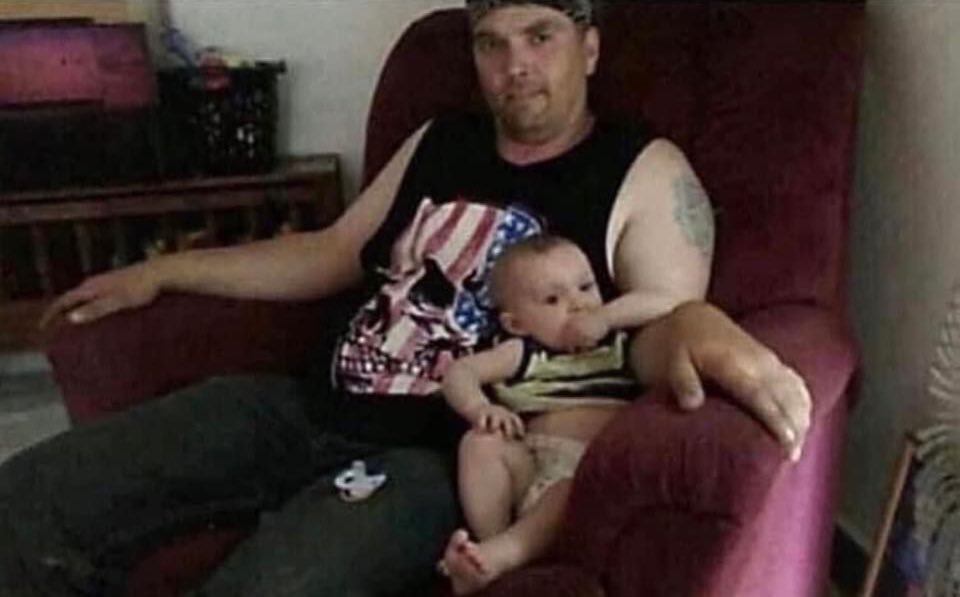 That baby’s hand is huge! And his father’s is…wait…