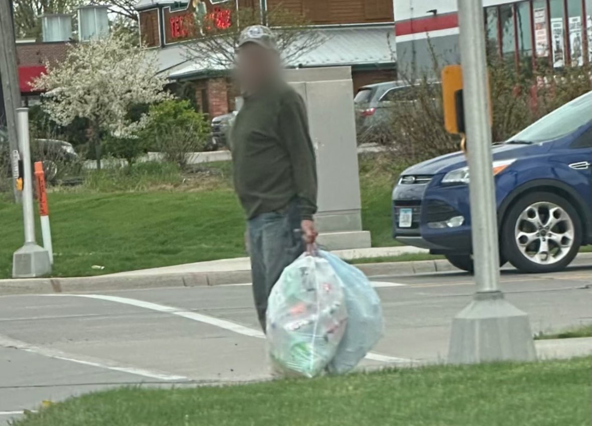 This blurry faced man is walking his trash bags, what a good pet owner 🥰