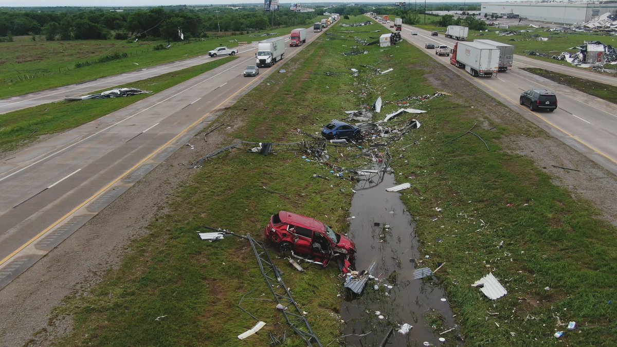 Images from Marietta, OK Tornado. Would appear as if cars and semis were tossed off the interstate last night next to the Dollar Tree DC that was impressively shredded to bits. #OKwx