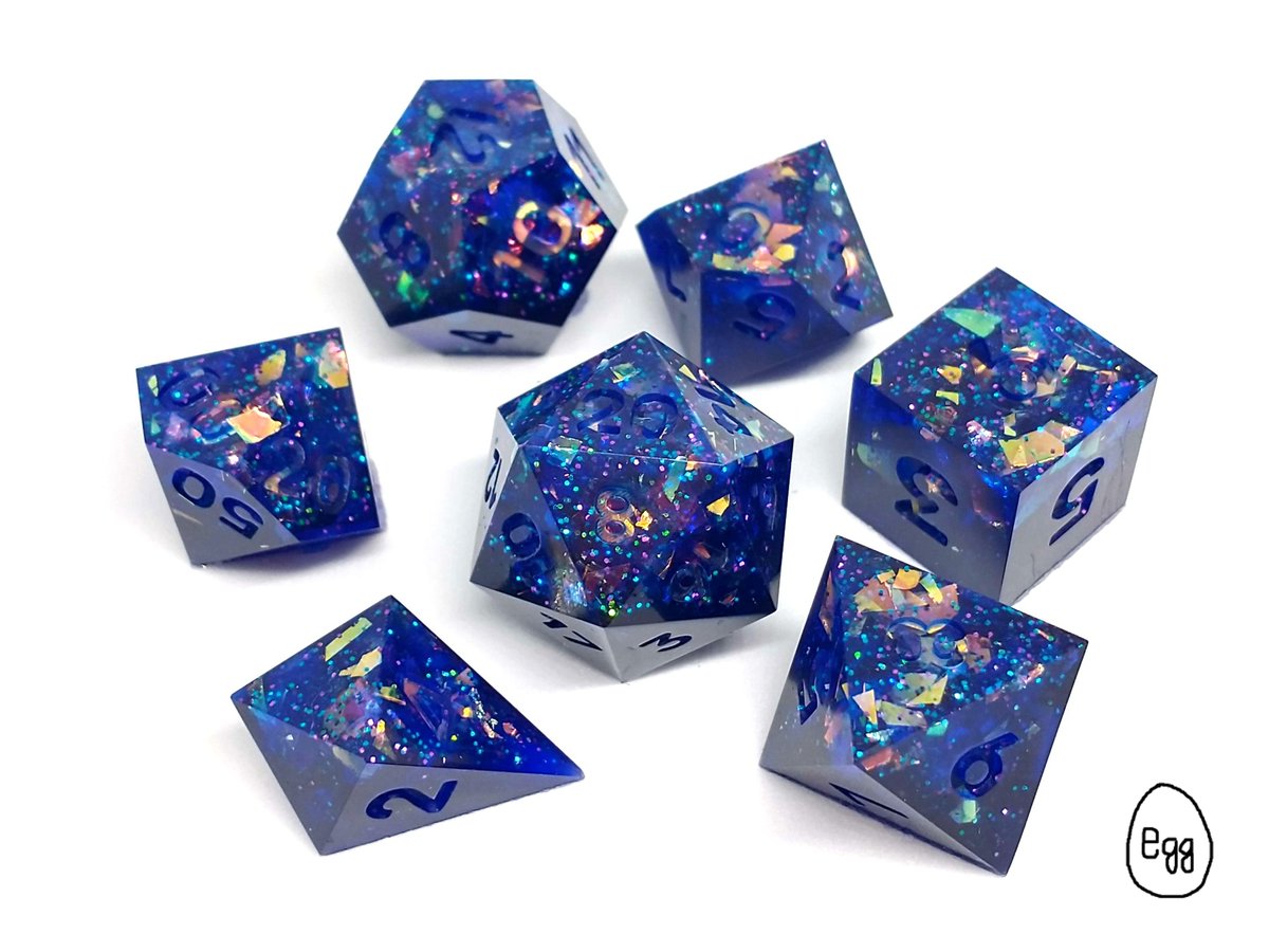 Blue sparkle dice. Slightly translucent with confetti always looks 10/10.

#beagoodegg2017
#dice
#dnd
#dnddice
#pathfinder
#dicegoblin
#handmade
#clickclack
#blue
#sparkle
#donoteat