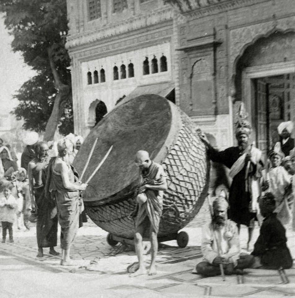 The Great Drum of the Darbar Sahib, Amritsar, Punjab - 1889: Nihangs alongside Brahmins can be seen with the drum. Researching into the presence of Brahmins in the Golden Temple prior to the 1900s suggests that Brahmins were honored with tributes in the Golden Temple since the…