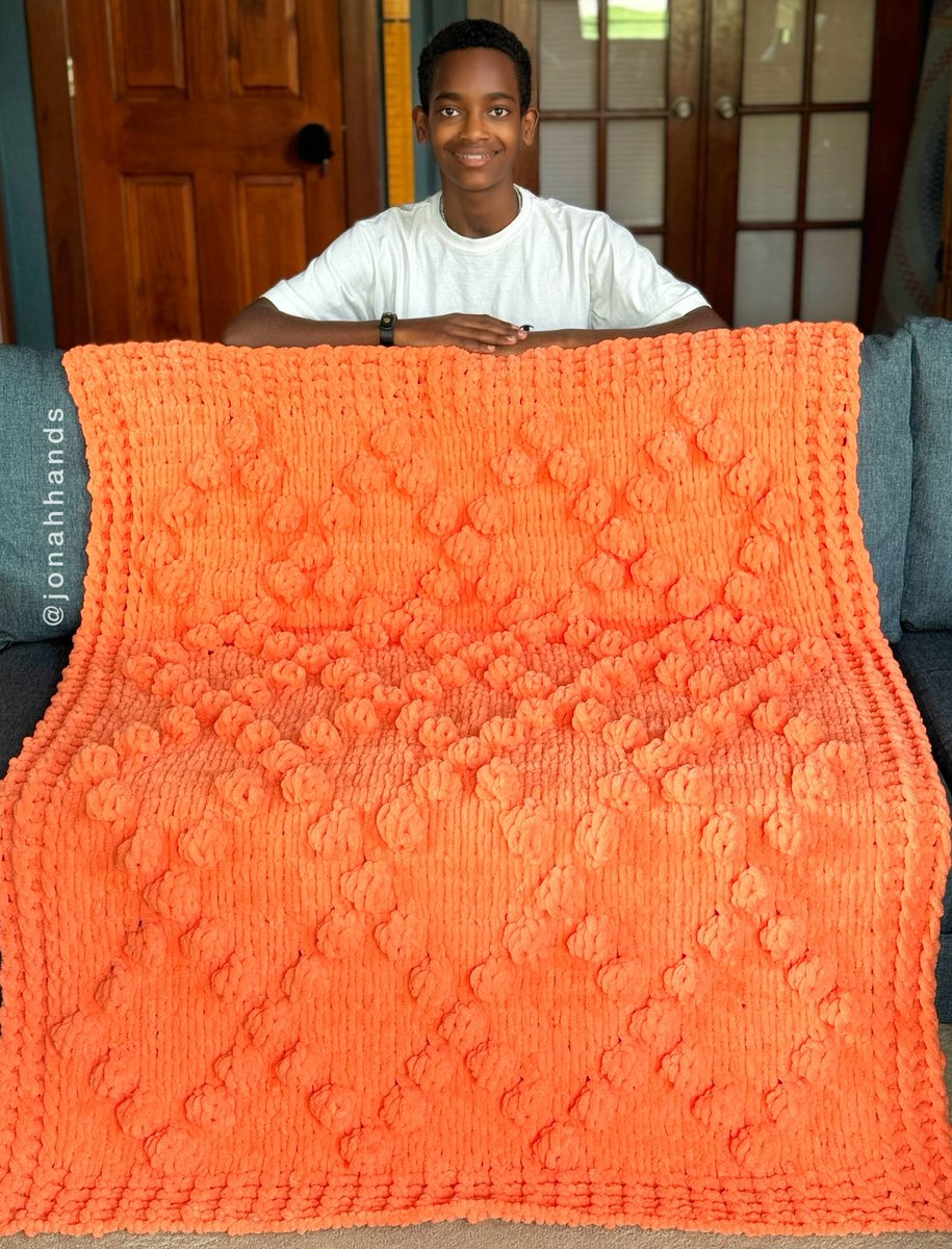 I made this bobble diamond blanket using just my fingers (no hooks/needles). What do you think of the orange color? Get the links to yarn and pattern on my website jonahhands.com