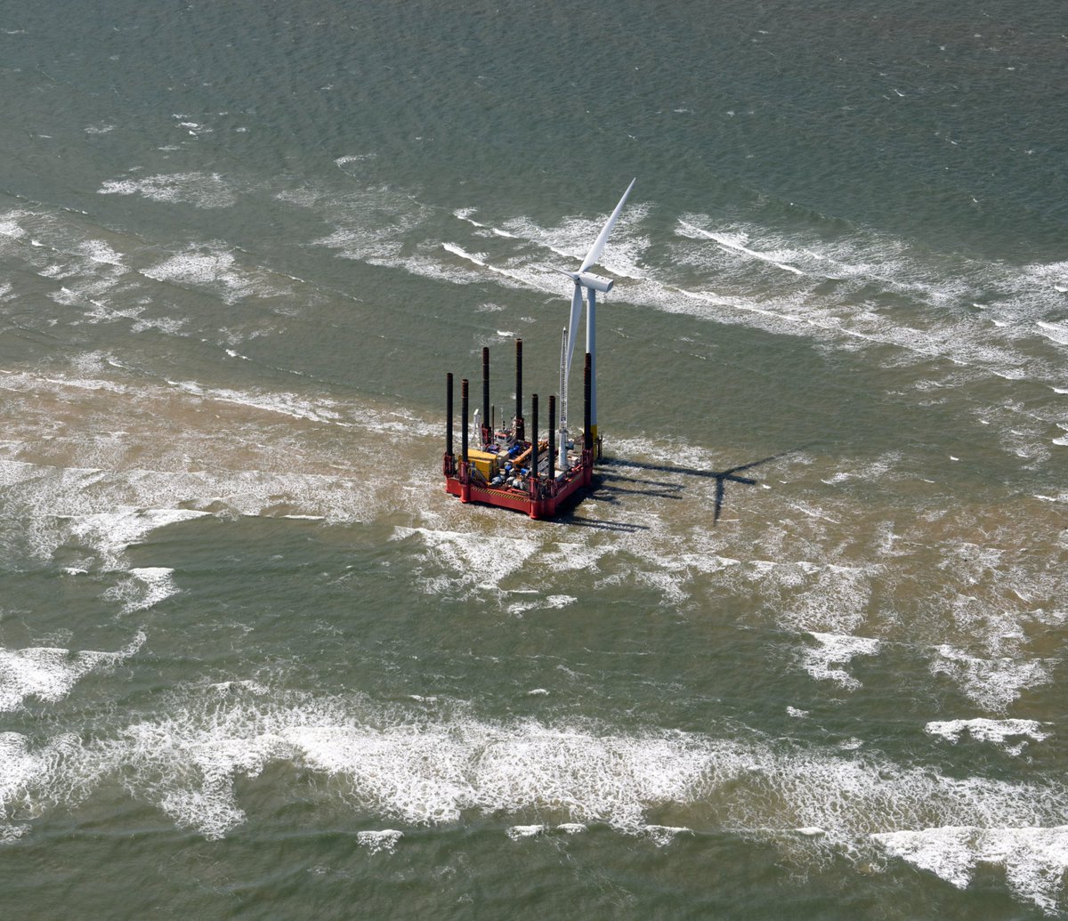 Scroby Sands aerial image - WaveWalker 8 legged walking jack-up barge servicing an offshore wind turbine on the Scroby Sands off Great Yarmouth #ScrobySands #windfarm #aerial #image #Norfolk #aerialphotography