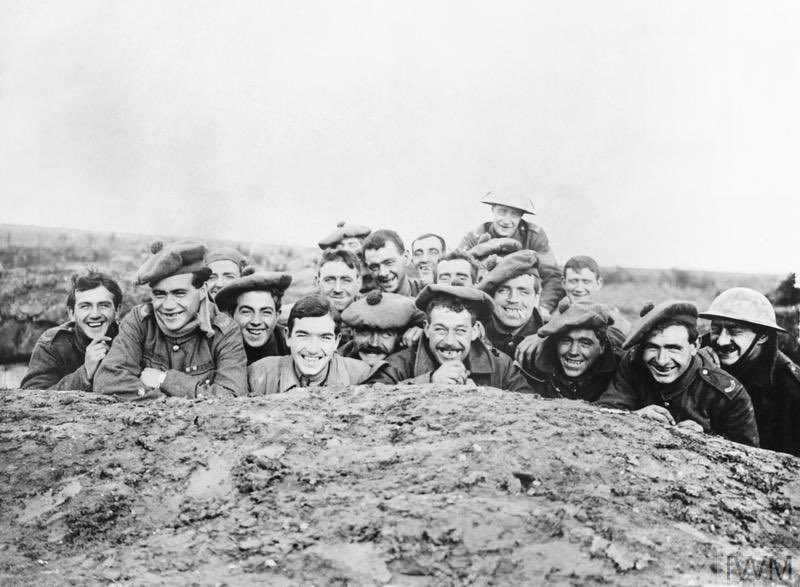 A portrait of a smiling group of Gordon Highlanders in a reserve trench, Bazentin-le-Petit, November 1916. IWM Q 4475