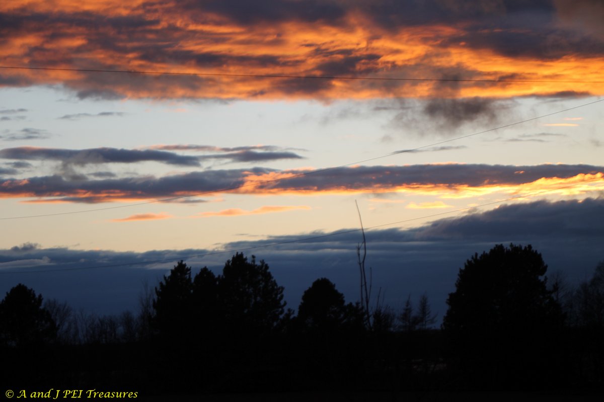 #GoodnightEveryone!  The clouds reflect the setting sun bringing a pop of colour to the photograph.  It makes the clouds look more  imposing.  #Thanks for the likes, shares, views, follows and interest in A & J PEI Treasures! #PrinceEdwardIsland #PEI #Canada #Canadian #sunset