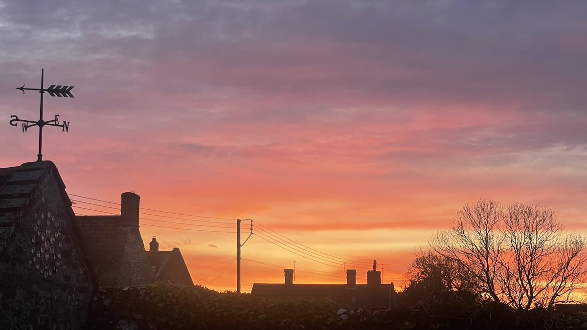 A Norfolk village sunset in April with singing blackbirds