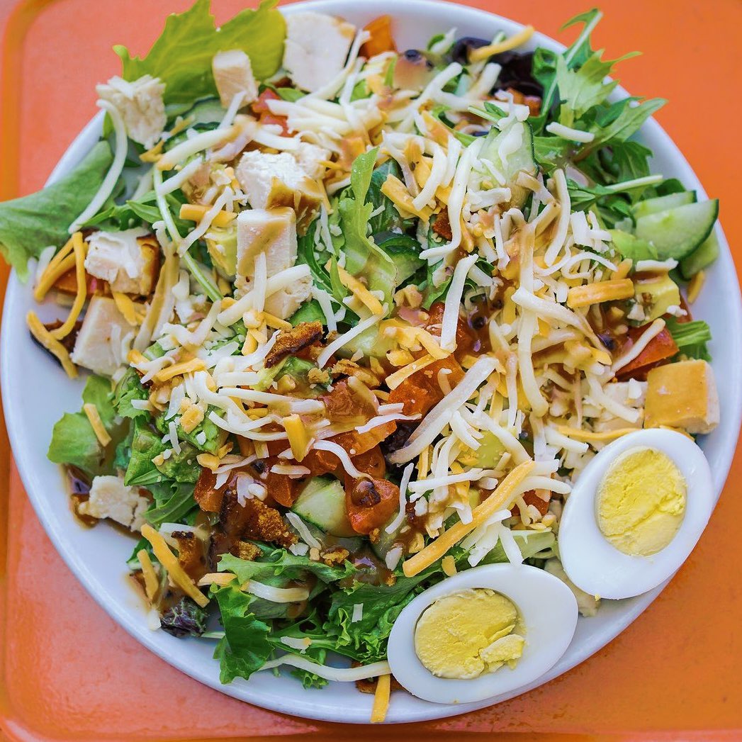 Sundays just got a whole lot tastier! 🥗 Treat yourself to our Cobb-ster Salad piled with turkey, creamy avocado, tomato, eggs, cucumber and drizzled with our tangy balsamic vinaigrette.