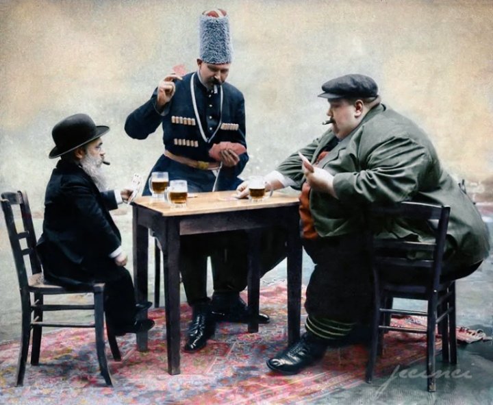 The shortest, tallest, and fattest man in Europe playing cards together in 1913.