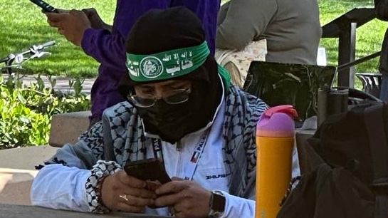 Stanford University - a male sits calmly, texting on his phone while wearing a Hamas headband.

A HAMAS HEADBAND, without a care in the world.
On an elite University campus. 
In America 2024.